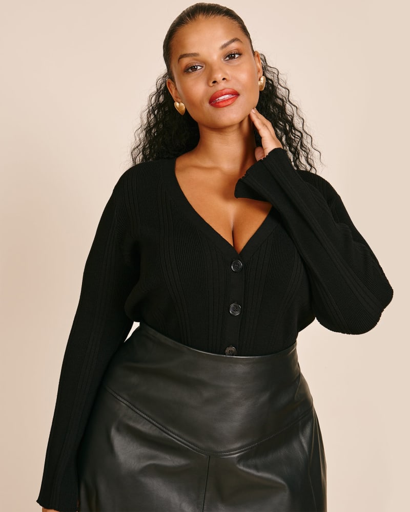 Front of a model wearing a size 0 Evelyn Fitted Cardigan in Black by 11 Honoré Collection. | dia_product_style_image_id:224122